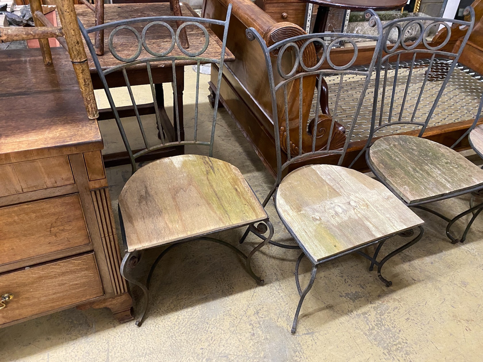 Five wrought iron wood seat garden chairs